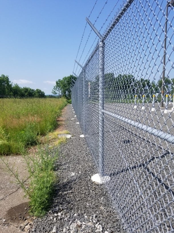 How To Keep Weeds Grass Off A Chain Link Fence Green Giant Services